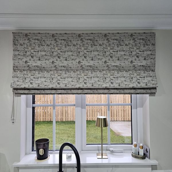 Textured roman blind fitted above a kitchen window